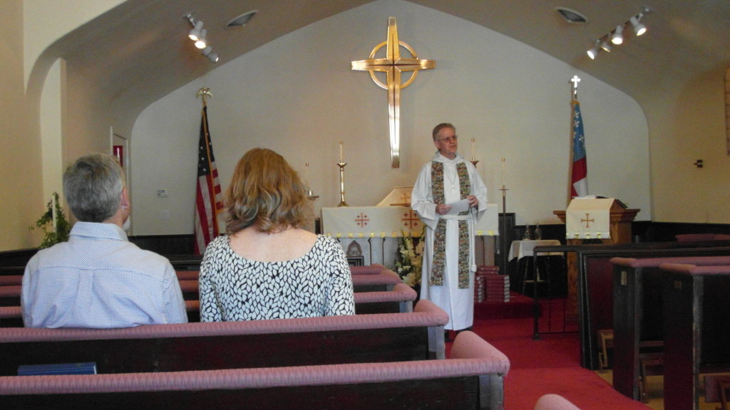 Father John gives a sermon.